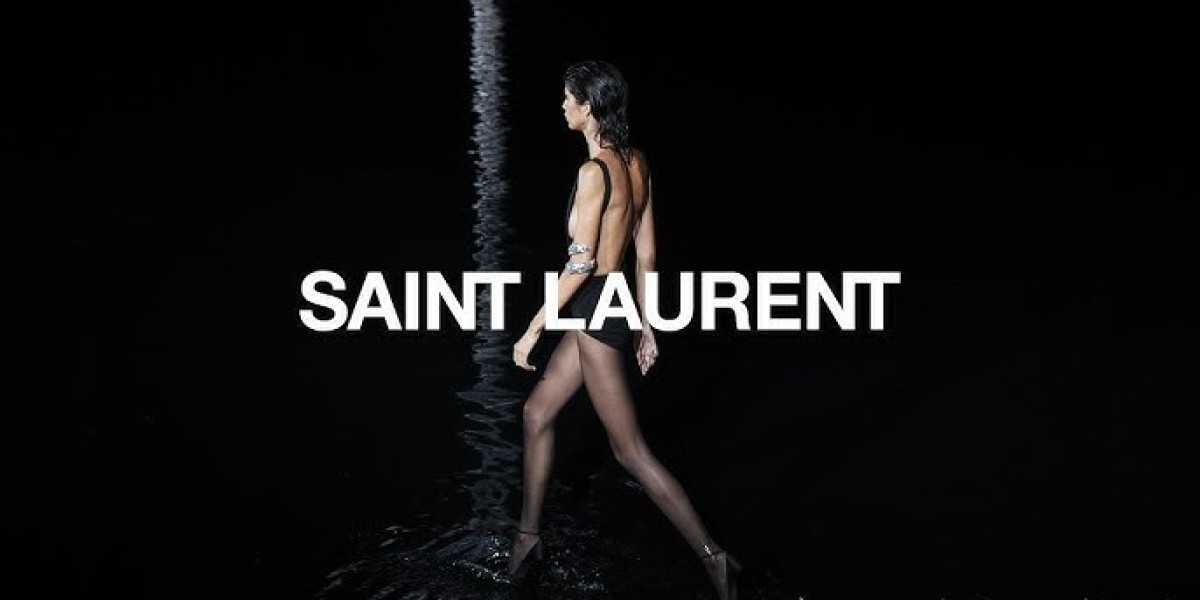 Saint Laurent with a foldable paper fan it way chicer than a battery